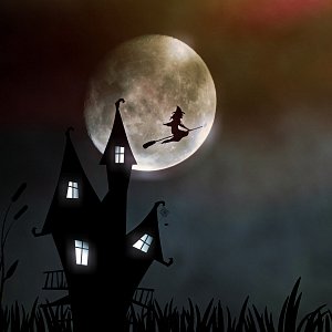 A witch flies past a full moon on a broomstick